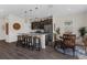 Bright kitchen with stainless steel appliances, a kitchen island, and dining area by sliding glass doors at 2532 Autumn Stream Dr, Leesburg, FL 34748