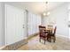 Cozy breakfast nook featuring a charming chandelier and a bright, airy atmosphere at 264 Juniper Way, Tavares, FL 32778