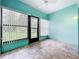 Cozy Florida room with views of the backyard and a ceiling fan at 264 Juniper Way, Tavares, FL 32778
