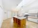 Spacious kitchen with center island, stainless steel appliances, and ample storage at 264 Juniper Way, Tavares, FL 32778