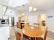 Eat-in kitchen with stainless steel appliances, center island, and pendant lighting at 264 Juniper Way, Tavares, FL 32778