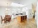 Bright, spacious kitchen with center island, skylight, and modern appliances at 264 Juniper Way, Tavares, FL 32778