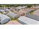An aerial perspective showcases homes with manicured lawns, and mature trees, creating a serene living environment at 2805 Burgos Dr, The Villages, FL 32162