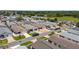 A sprawling aerial view of a well-maintained residential community with uniform landscaping at 2805 Burgos Dr, The Villages, FL 32162