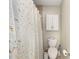 Clean bathroom showcasing a toilet and a shower with a decorative curtain at 2805 Burgos Dr, The Villages, FL 32162