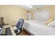 Bedroom featuring a desk and chair, with a large window and closet at 2805 Burgos Dr, The Villages, FL 32162