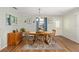 This dining area features hard wood floors and a door with decorative glass at 2805 Burgos Dr, The Villages, FL 32162