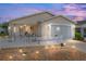 Charming home with a well-lit front yard, screened porch and a white picket fence at 2805 Burgos Dr, The Villages, FL 32162