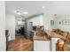 Bright kitchen featuring stainless steel appliances, granite countertops, and convenient bar seating at 2805 Burgos Dr, The Villages, FL 32162