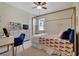 This bedroom features a four-poster bed, a ceiling fan, and a desk with a vanity mirror at 30532 Gidran Ter, Mount Dora, FL 32757