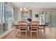 Charming dining area with elegant curtains and a view of the backyard at 30532 Gidran Ter, Mount Dora, FL 32757