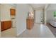 Well-lit entryway with decorative furnishings and convenient access to the laundry room at 30532 Gidran Ter, Mount Dora, FL 32757