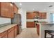 Spacious kitchen with stainless steel appliances, granite countertops, and ample cabinet space at 30532 Gidran Ter, Mount Dora, FL 32757