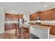 Modern kitchen with stainless steel appliances and a breakfast bar with seating at 30532 Gidran Ter, Mount Dora, FL 32757