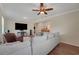 Comfortable living area with a large sofa, recliner, and hardwood flooring at 30532 Gidran Ter, Mount Dora, FL 32757