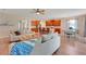 Bright living room featuring hardwood floors, ceiling fan, and open concept kitchen at 30532 Gidran Ter, Mount Dora, FL 32757