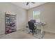 This home office features a desk with a computer, a printer, and shelving for storage at 30532 Gidran Ter, Mount Dora, FL 32757