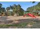 Community playground with slides, climbing structures, and play areas in a park setting at 30532 Gidran Ter, Mount Dora, FL 32757