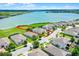 Aerial view highlighting property boundaries and a view of a large lake, showcasing the real estate's prime location at 313 Blue Cypress Dr, Groveland, FL 34736