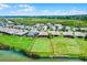 Beautiful aerial view of a lakeside home with a large backyard in a vibrant community on a sunny day at 313 Blue Cypress Dr, Groveland, FL 34736