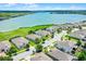 Aerial view highlighting the proximity of houses to a beautiful lake, showing the community's scenic waterfront location at 313 Blue Cypress Dr, Groveland, FL 34736
