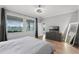 This bedroom is light and bright with a view of the lush backyard and water at 313 Blue Cypress Dr, Groveland, FL 34736