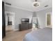This bedroom includes an ensuite bath with a walk-in shower and a spacious closet at 313 Blue Cypress Dr, Groveland, FL 34736