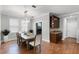 Bright dining room with wood floors, recessed lighting, and a modern chandelier at 313 Blue Cypress Dr, Groveland, FL 34736