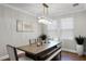 Bright dining room with modern chandelier and lots of natural light at 313 Blue Cypress Dr, Groveland, FL 34736