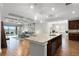 Open concept kitchen with granite counters flows into the sunny living area at 313 Blue Cypress Dr, Groveland, FL 34736