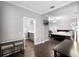 Open main bedroom layout connecting to an ensuite bathroom and featuring a comfortable bed at 313 Blue Cypress Dr, Groveland, FL 34736