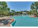 The community pool features a water slide and a shallow area for younger swimmers at 313 Blue Cypress Dr, Groveland, FL 34736