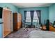 Bedroom with guitars and window to the outside at 395 Blue Cypress Dr, Groveland, FL 34736