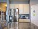 Kitchen featuring stainless steel appliances and ample cabinet storage at 395 Blue Cypress Dr, Groveland, FL 34736