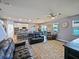 Spacious living room offers an open layout with modern finishes and seamless flow to the kitchen at 395 Blue Cypress Dr, Groveland, FL 34736