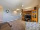 Spacious living room with ceiling fan and entertainment center is great for lounging at 395 Blue Cypress Dr, Groveland, FL 34736