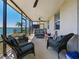 Relaxing screened patio overlooking the water with comfortable seating, perfect for enjoying the lake views at 395 Blue Cypress Dr, Groveland, FL 34736