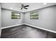 Bedroom featuring wood-look flooring, neutral walls, recessed lighting, and a ceiling fan at 4123 County Road 124, Wildwood, FL 34785