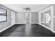 Bright and airy living room with modern flooring, fresh paint and access to the backyard at 4123 County Road 124, Wildwood, FL 34785