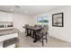 Bright dining area with tile floors and a view through sliding glass doors leading to the backyard at 4713 Sw 86 Ln, Ocala, FL 34476