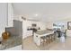 Modern kitchen with stainless steel appliances, granite countertops, and a large island with seating at 4713 Sw 86 Ln, Ocala, FL 34476
