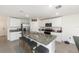Modern kitchen with stainless steel appliances, granite countertops, and a large island with seating at 4713 Sw 86 Ln, Ocala, FL 34476