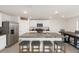 Modern kitchen with stainless steel appliances, granite countertops, and a large island with seating at 4713 Sw 86 Ln, Ocala, FL 34476