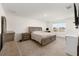 Spacious main bedroom with plush carpeting, neutral tones, and ample natural light from the bright window at 4713 Sw 86 Ln, Ocala, FL 34476