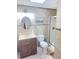 Updated bathroom with walk-in shower, modern vanity, and neutral tile at 48 Pinehurst Cir, Ormond Beach, FL 32174