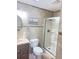 Bright bathroom features a walk-in shower and stylish neutral tile at 48 Pinehurst Cir, Ormond Beach, FL 32174