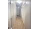 Hallway view with multiple doors and closet providing easy access to rooms and storage at 48 Pinehurst Cir, Ormond Beach, FL 32174