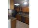Well-equipped kitchen featuring stainless steel appliances, granite countertops, and tiled flooring at 48 Pinehurst Cir, Ormond Beach, FL 32174