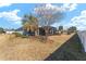 Wide backyard with view of enclosed lanai at 4987 Belted Kingfisher Dr, Oxford, FL 34484