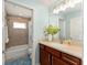 Bathroom with vanity, tile floors and shower/tub combo at 4987 Belted Kingfisher Dr, Oxford, FL 34484